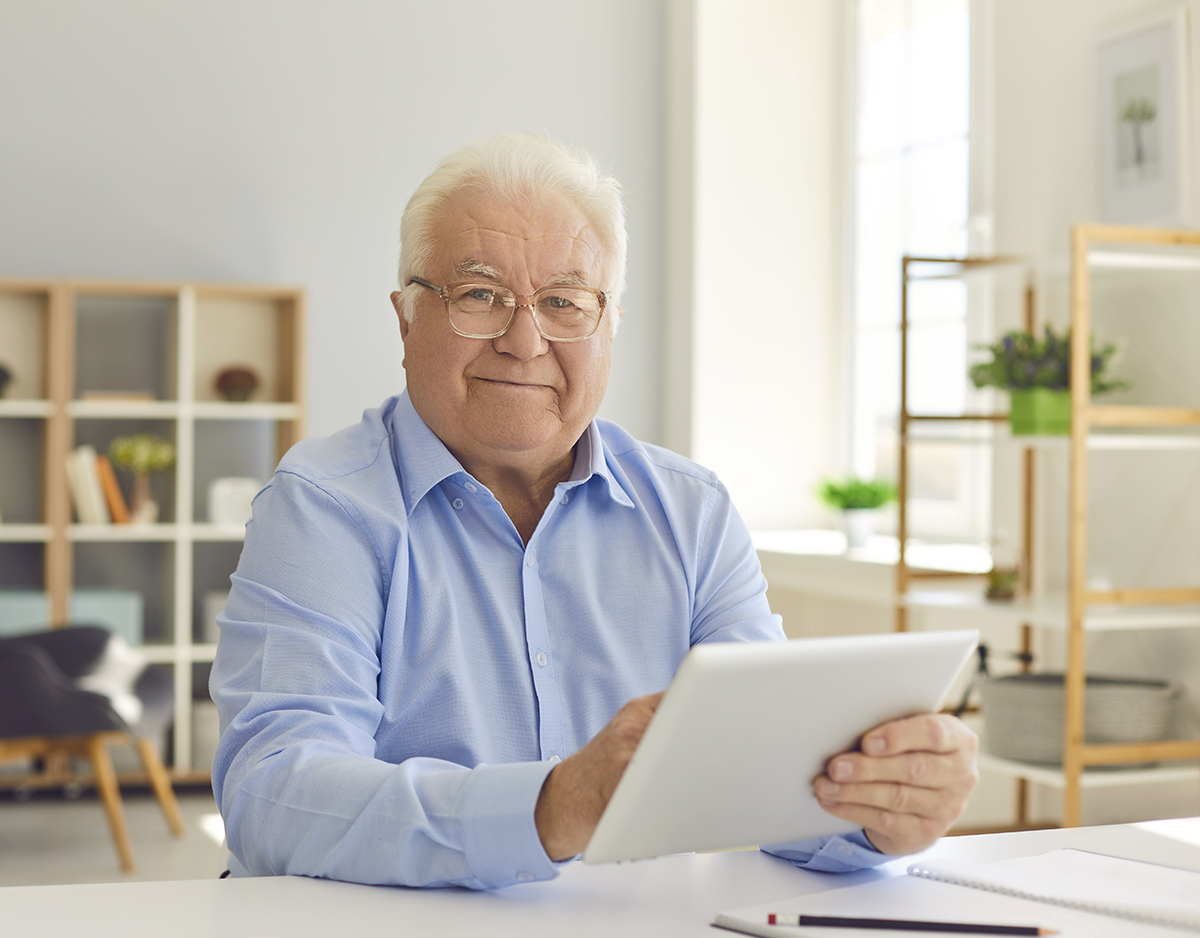 Senior citizen using tablet